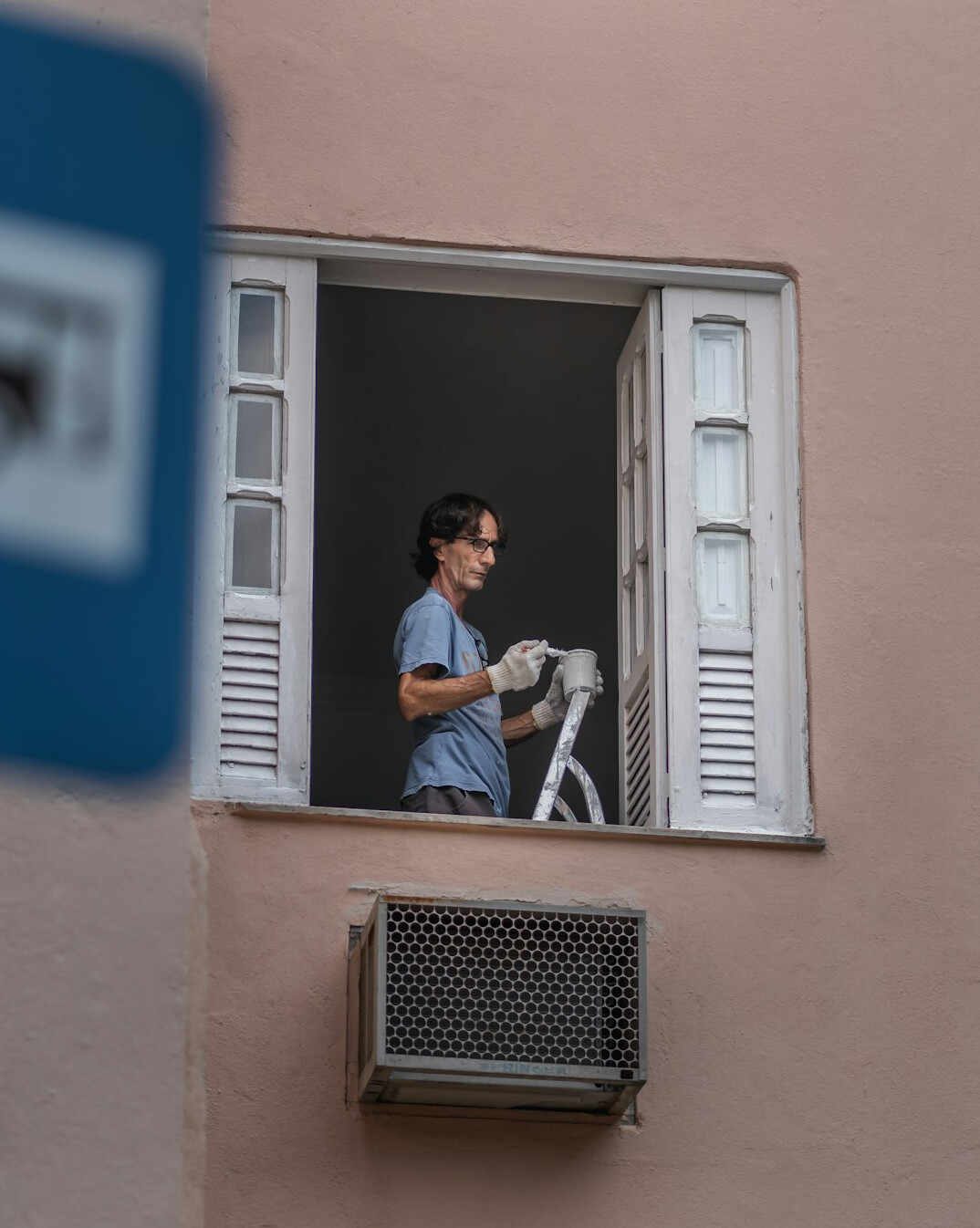 woman cleaning window glass