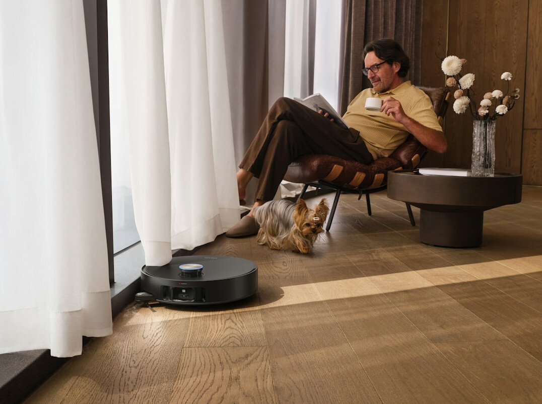 person mopping hardwood floor