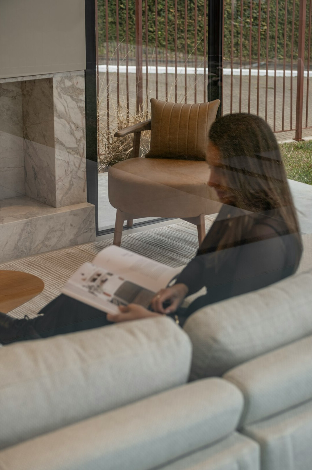 woman dusting living room furniture