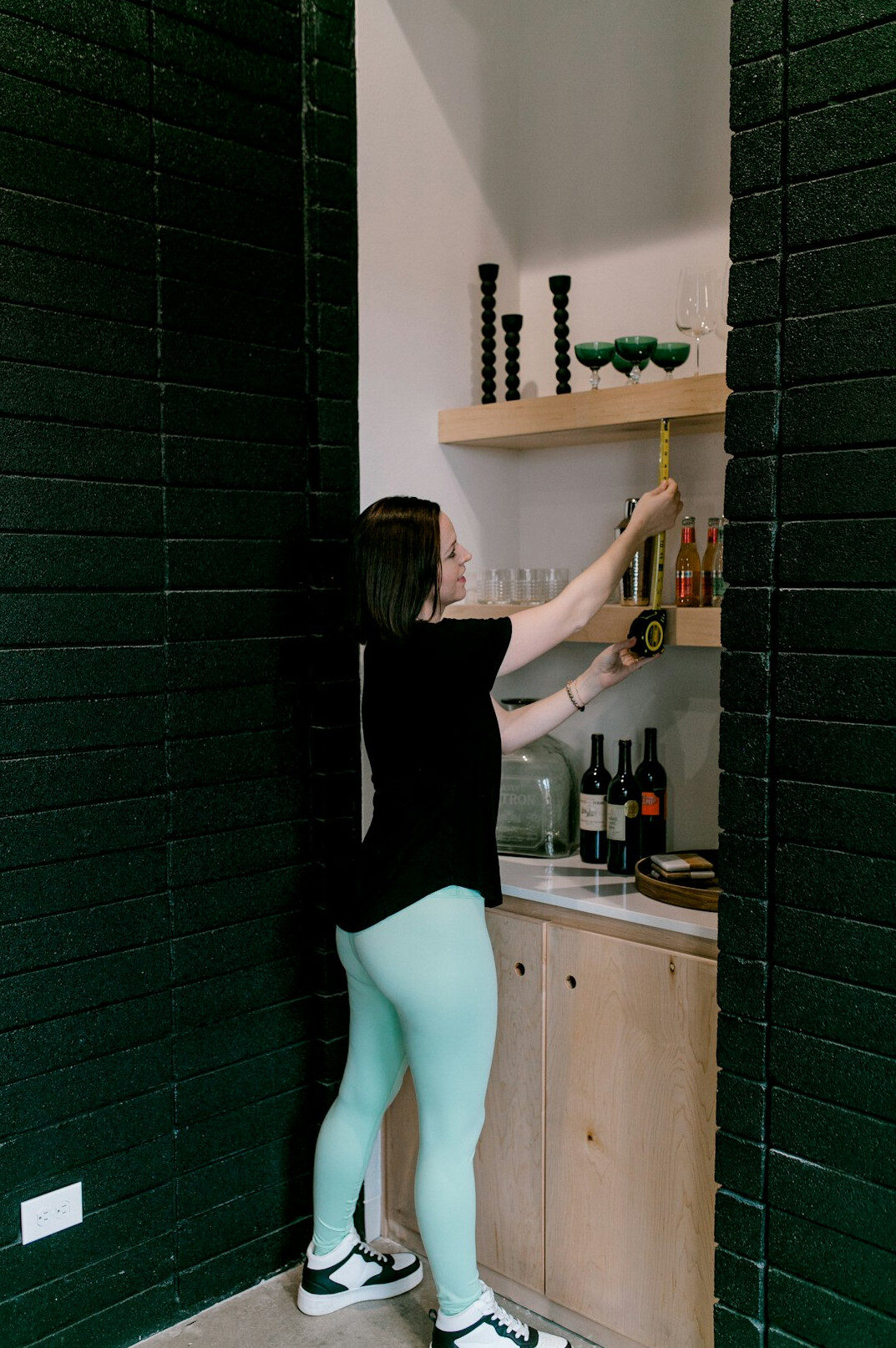 woman organizing closet shelves
